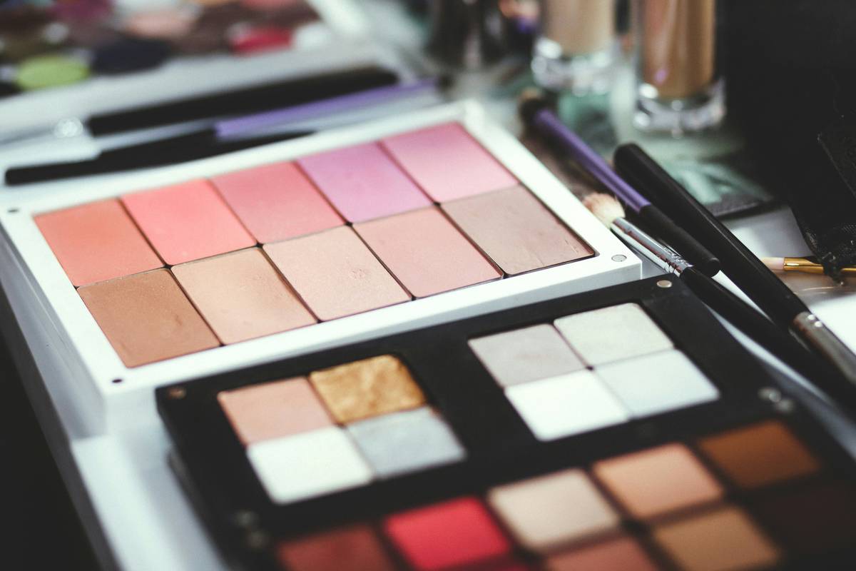 Comparison chart showing pigment density, wear time, and price-per-wear of premium vs. drugstore makeup across foundation, lipstick, and eyeshadow